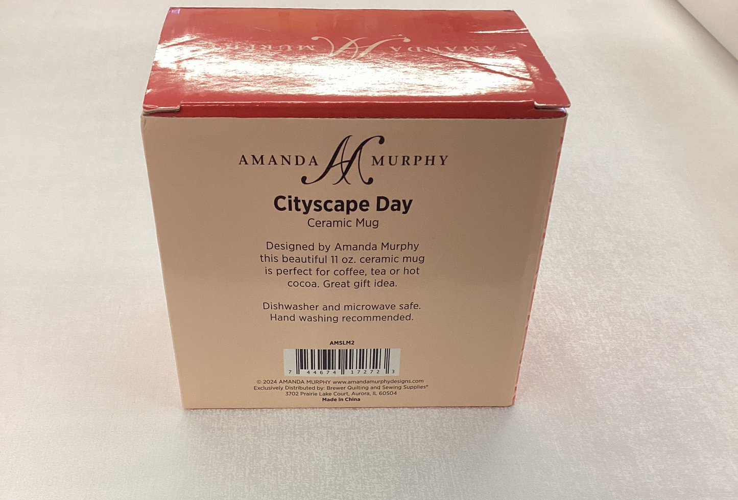 Ceramic Mug - white mug with turquoise background, red and pink buildings